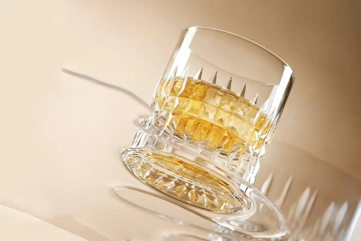 Heavy base detail of a whiskey tumbler designed for stable bar use