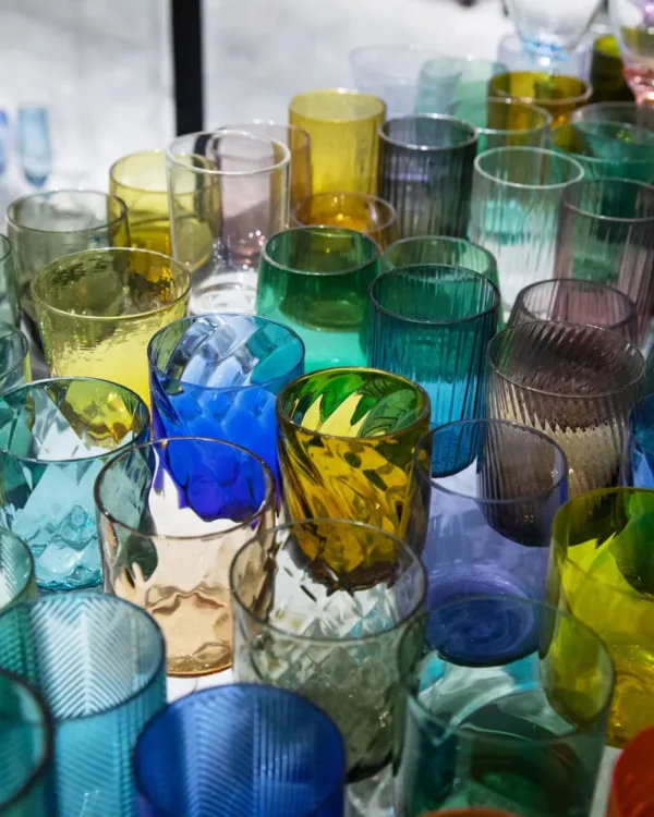 Custom glassware collection showing different cup shapes, colors, patterns, and decoration options