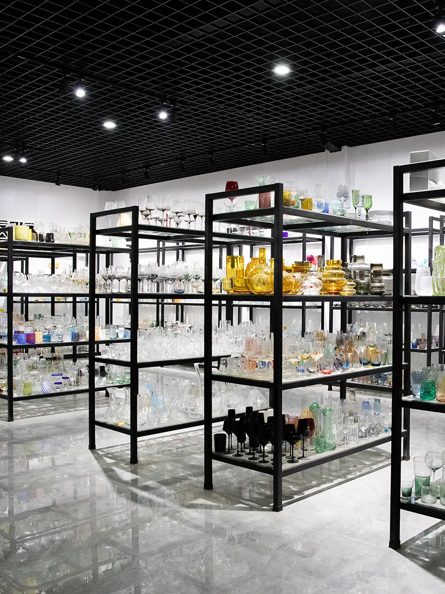 Glassware samples displayed in a factory showroom for custom glassware development
