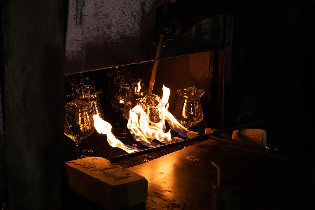 Glassware entering the annealing process for controlled cooling and stress reduction