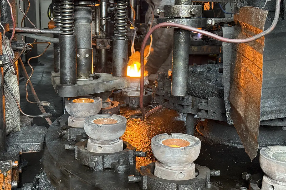 Press molding machine used in the glass cup forming process